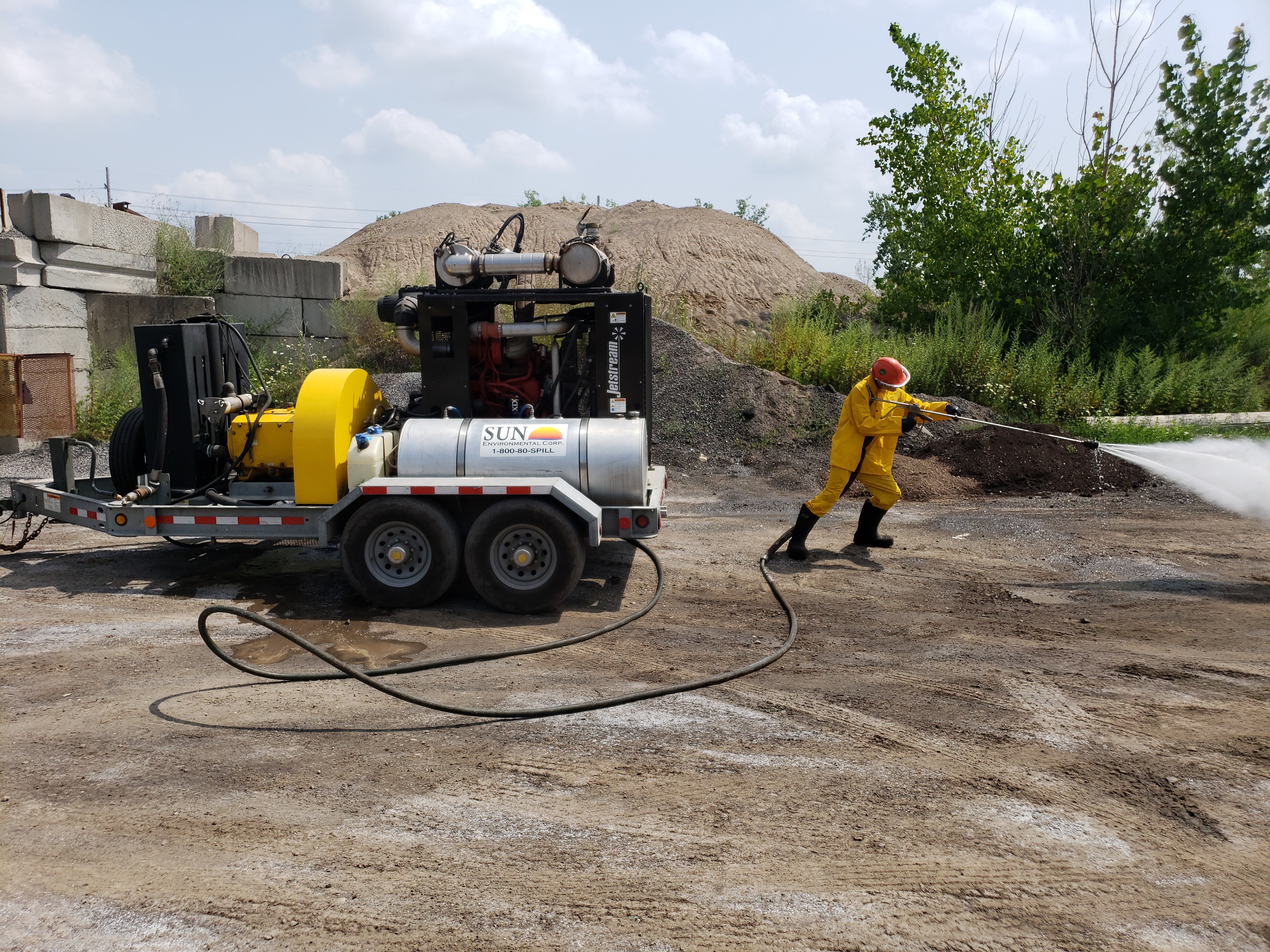 Sun Environmental Corp. crew member using hydroblaster